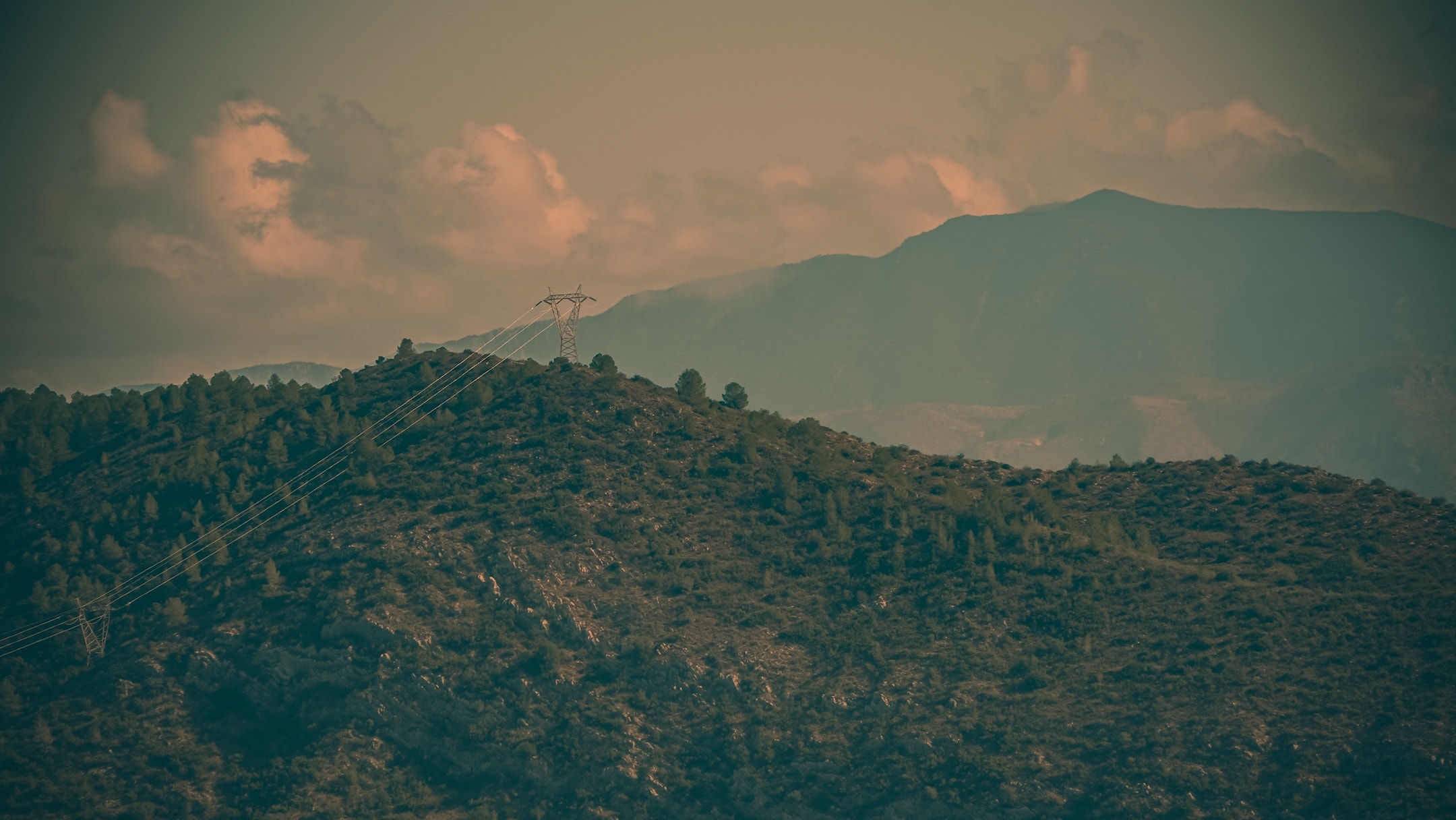 Distant mountains beneath sunlit clouds photographed by Eugene Truuts