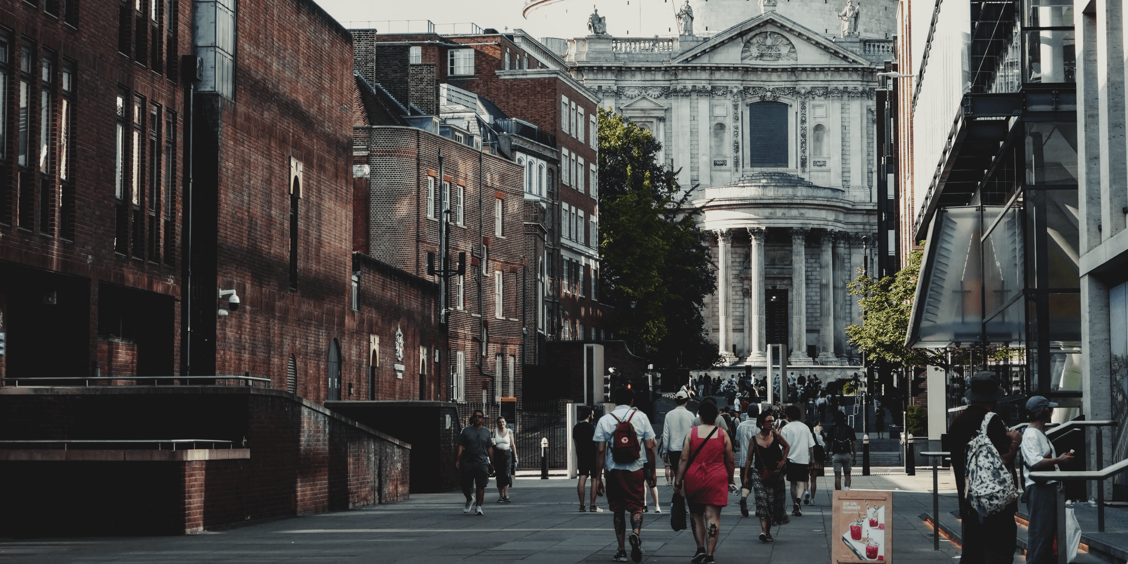 Pedestrians on a historic city street photographed by Eugene Truuts